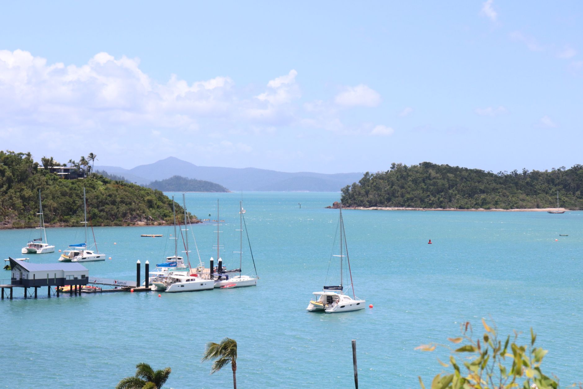 A day-sail catamaran anchored off the Whitsunday Islands, the usual way to reach Hill Inlet and Whitehaven Beach.