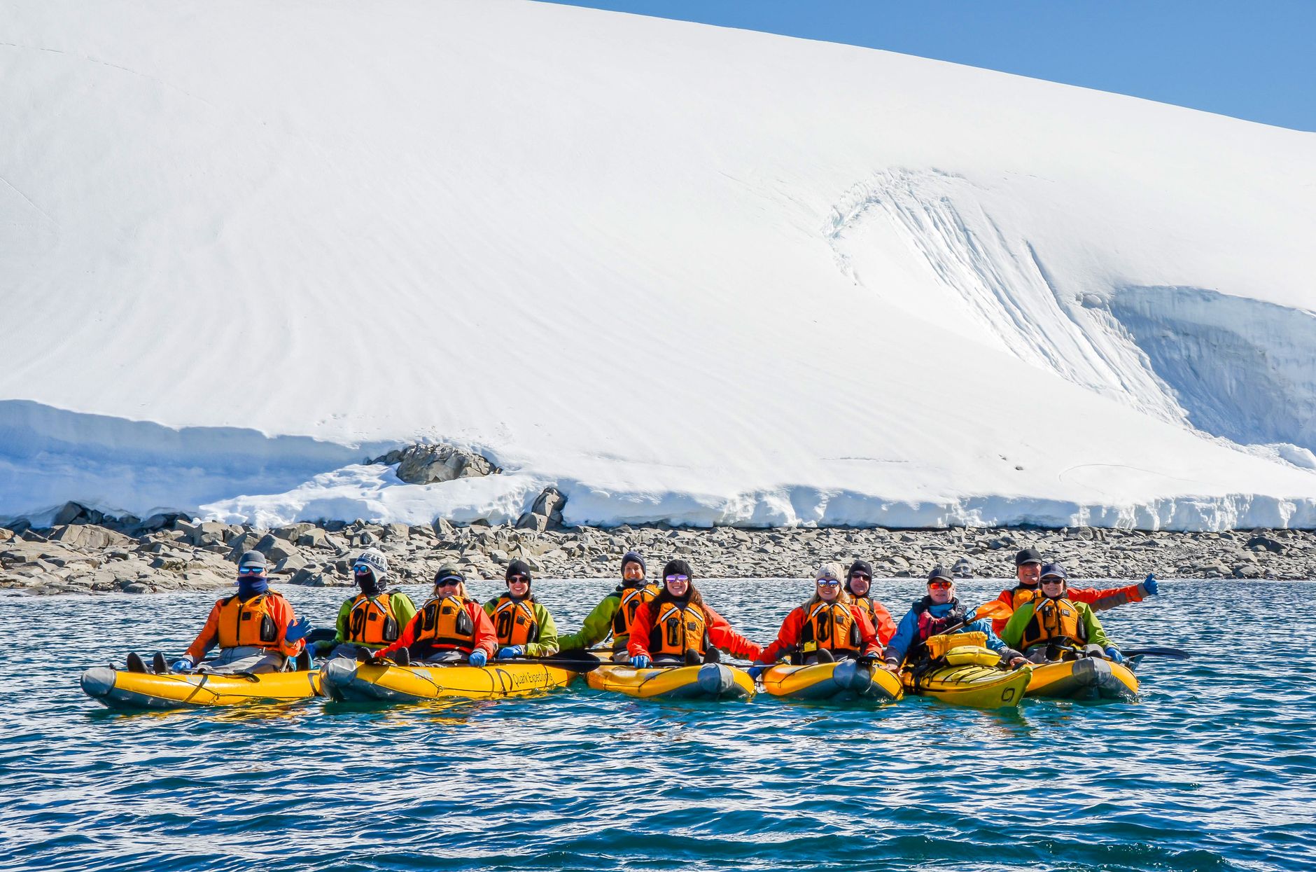 A kayaker holds distance from a tabular iceberg calved off the Antarctic Peninsula's glaciers.