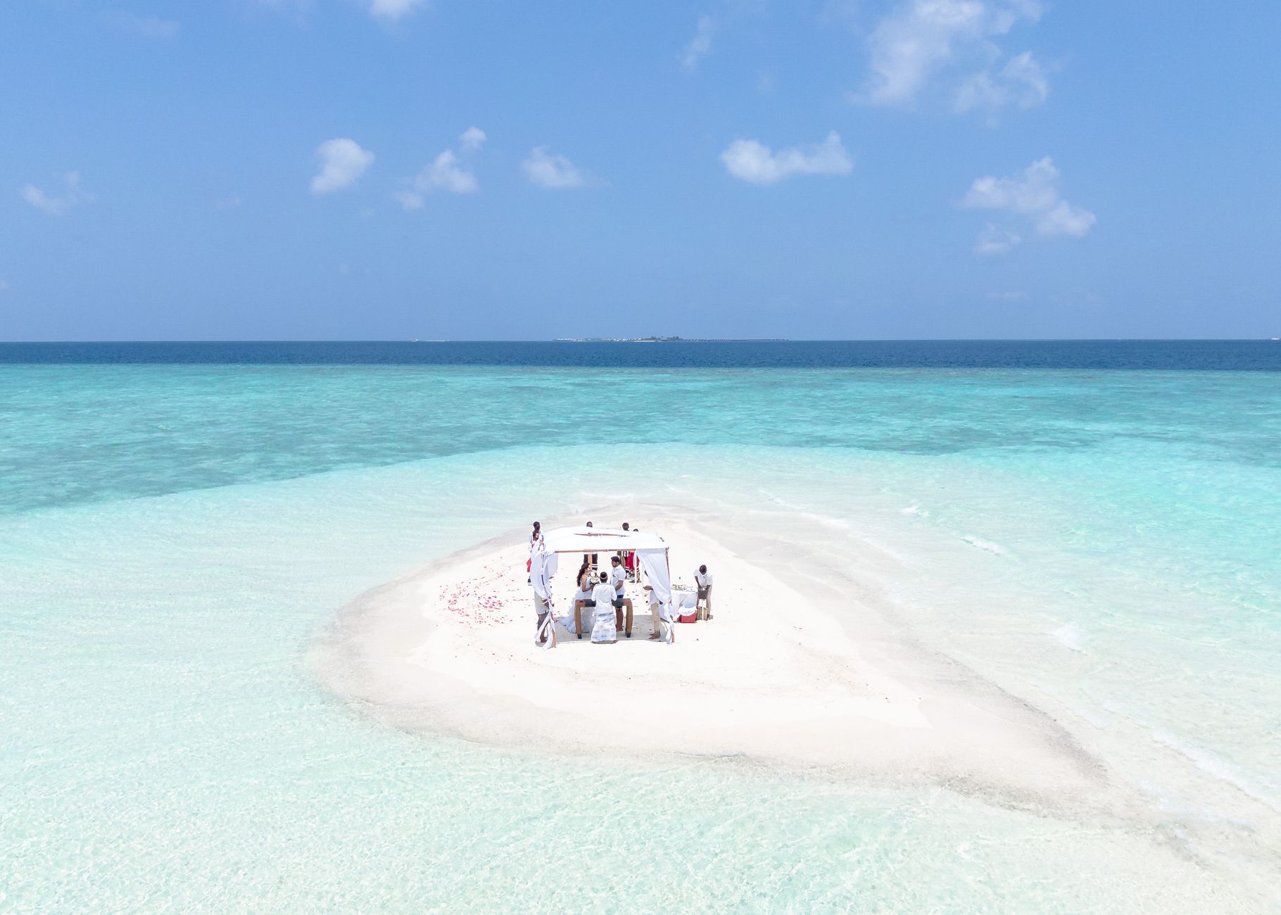 A private sandbank picnic, arranged by resort staff and reachable only by speedboat.