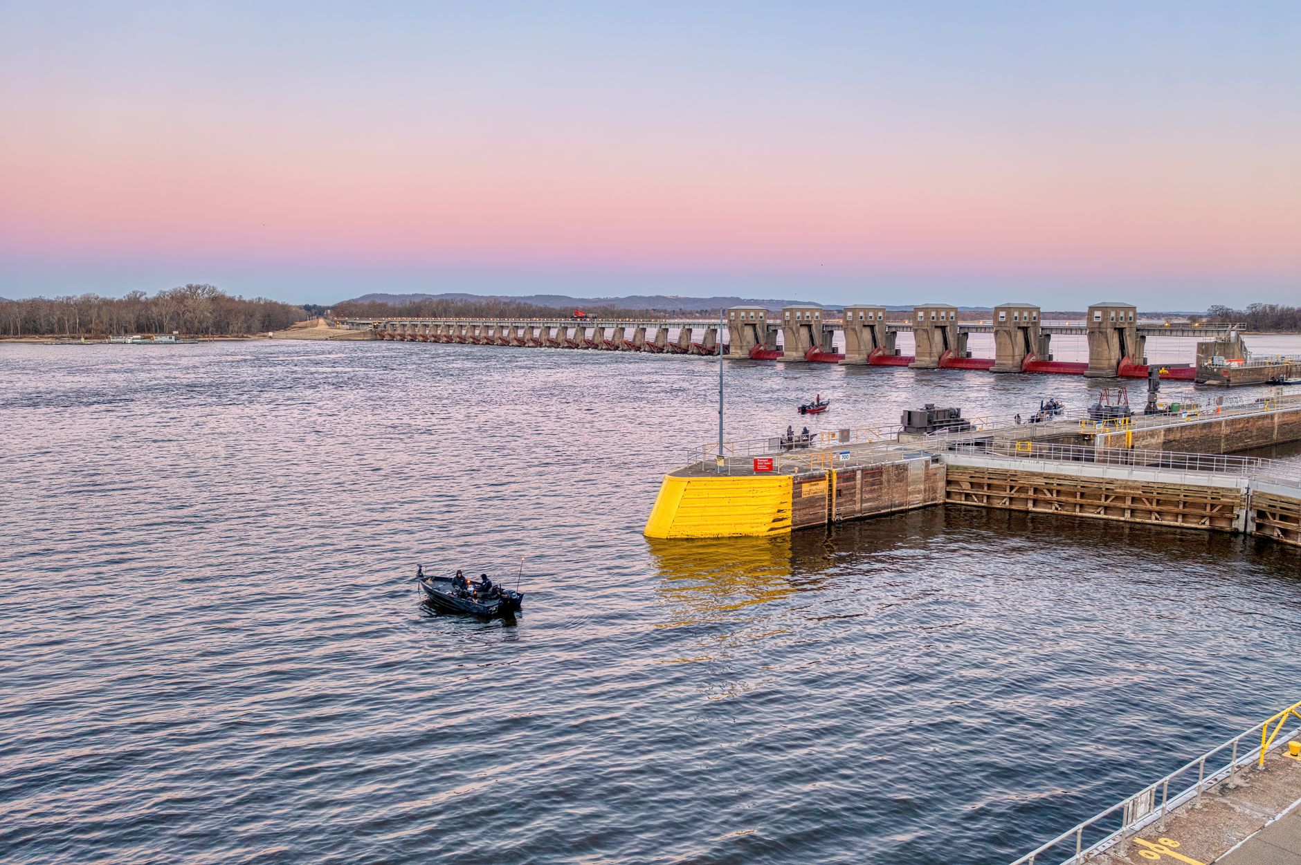 A riverboat eases into a lock chamber on the Upper Mississippi, a routine maneuver that still draws a crowd to the rail.