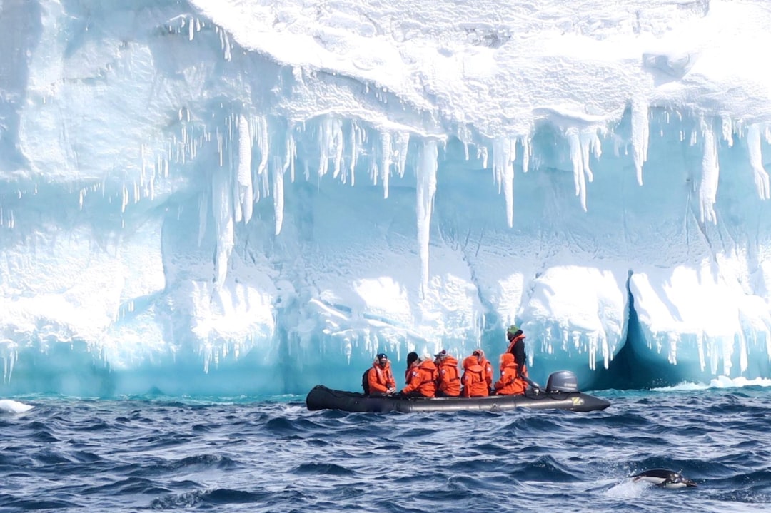 A submersible is lowered into the water for a dive beneath the Weddell Sea's ice-strewn surface, a Seabourn Venture signature outing.