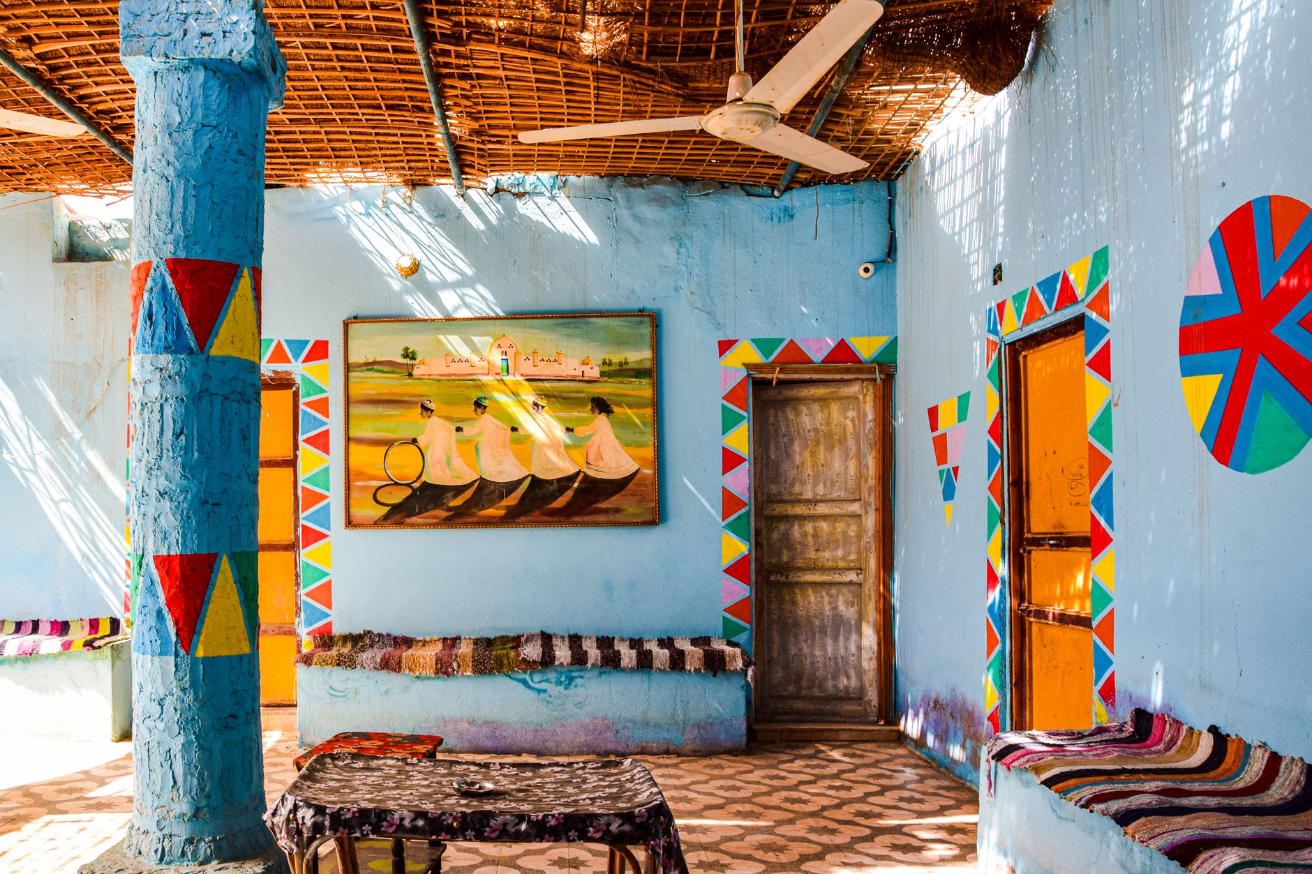A turquoise-painted Nubian courtyard along the riverbank near Sehel Island.