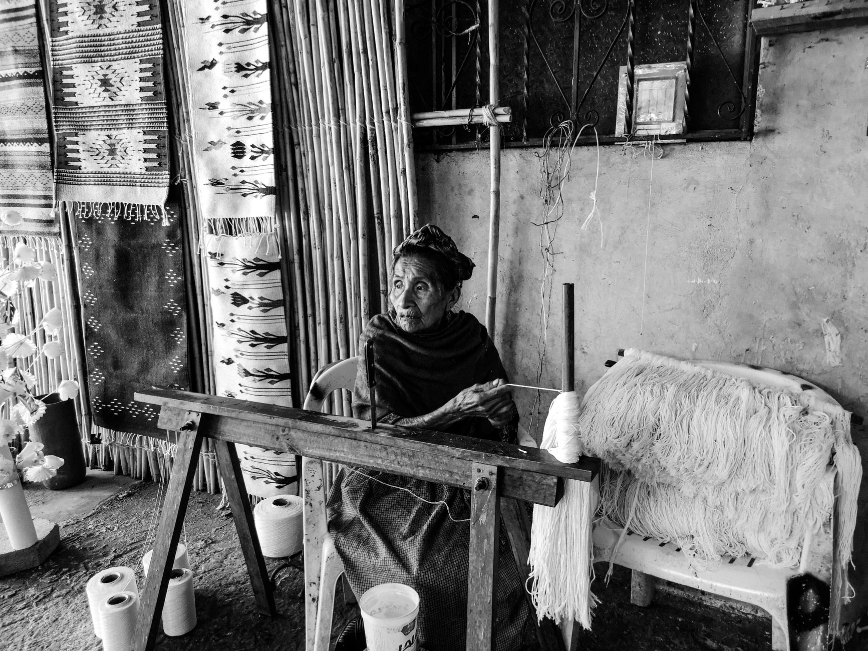 A weaver in Teotitlán del Valle works a pedal loom, a craft passed down through Zapotec families for generations.
