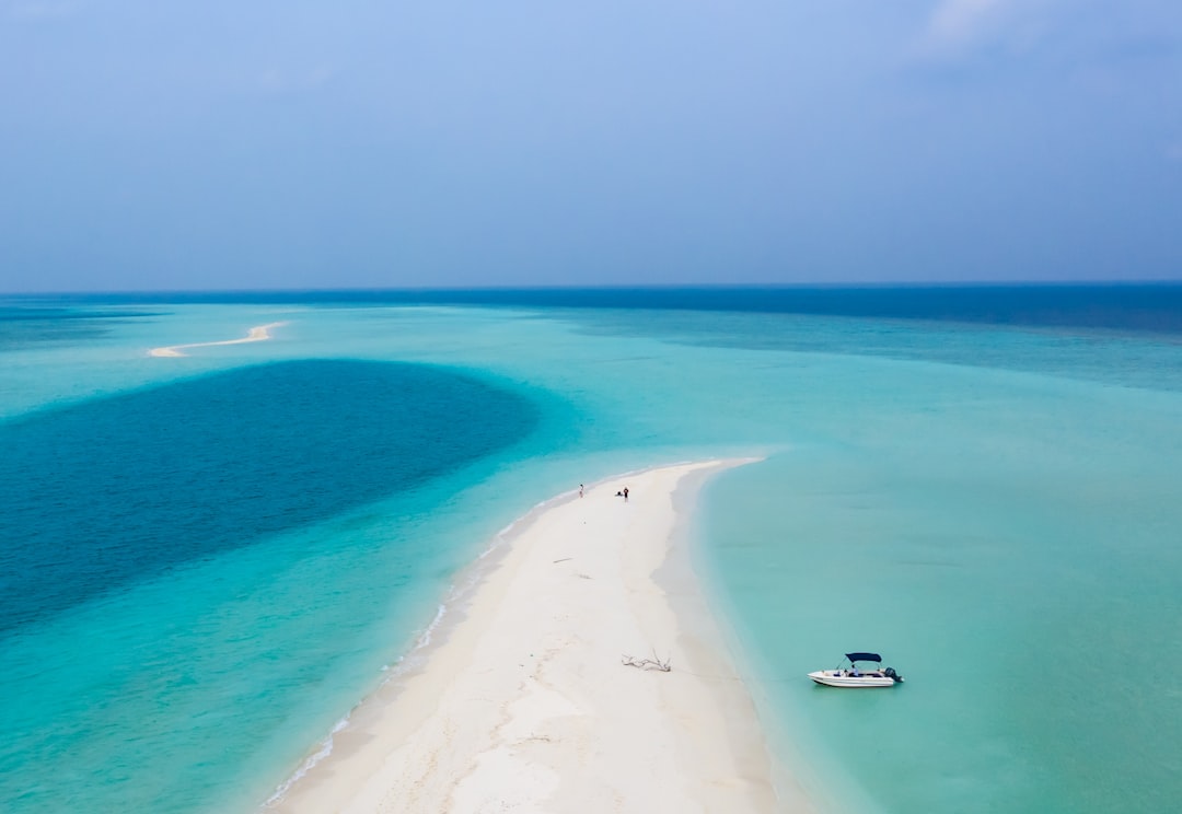 Aerial photograph of Maldivian atoll showing white sand beaches and bright turquoise waters