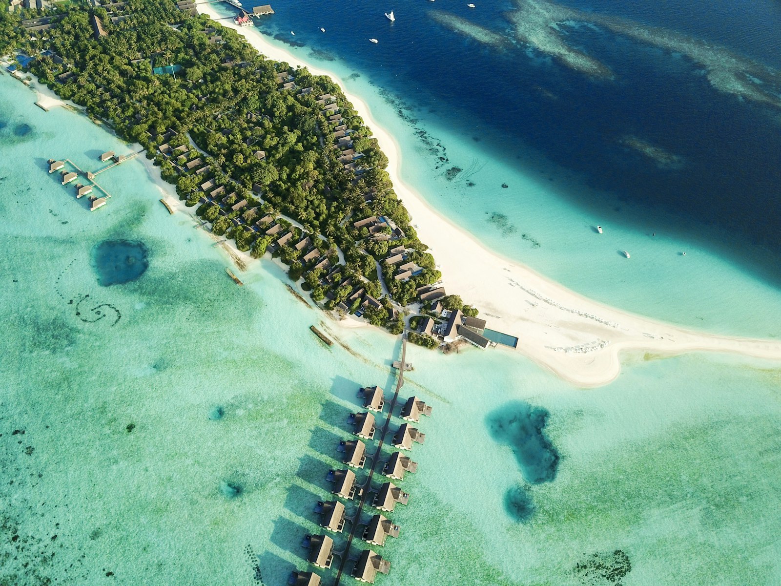 Aerial view of Baa Atoll showing turquoise lagoon and coral islands