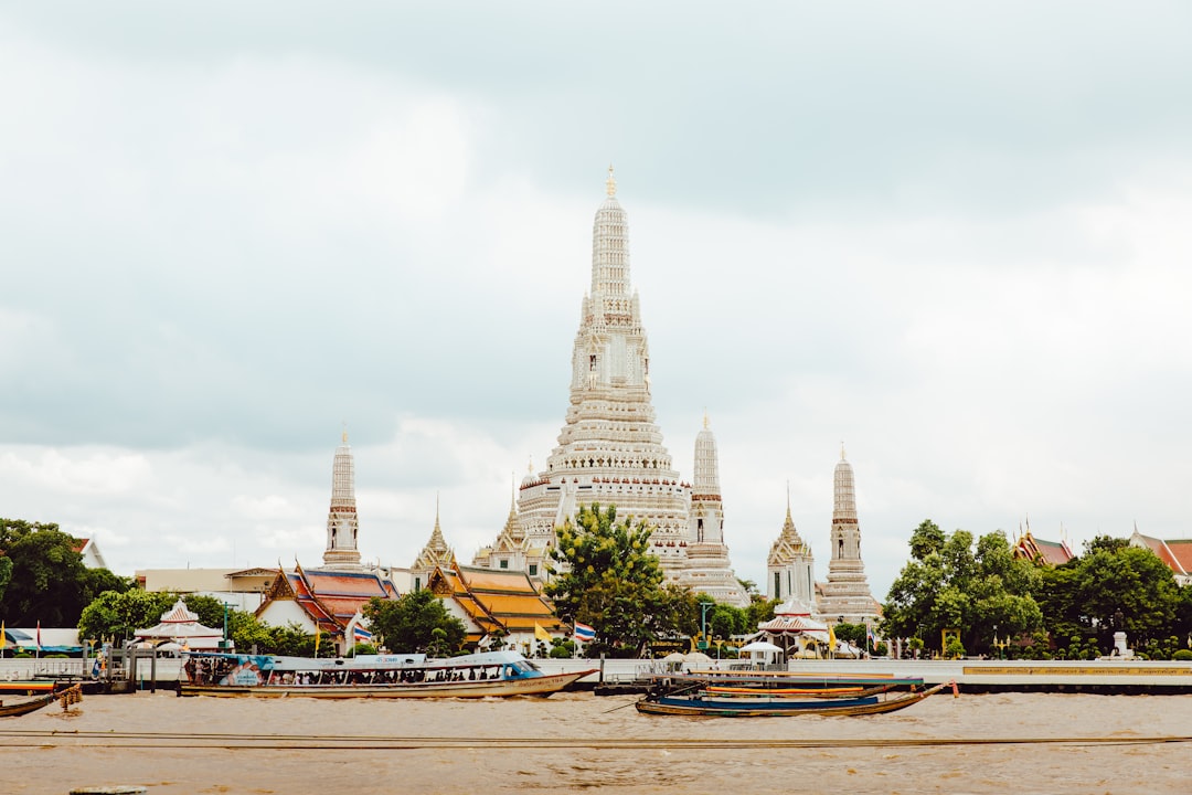 Bangkok skyline with temples and river in spring haze