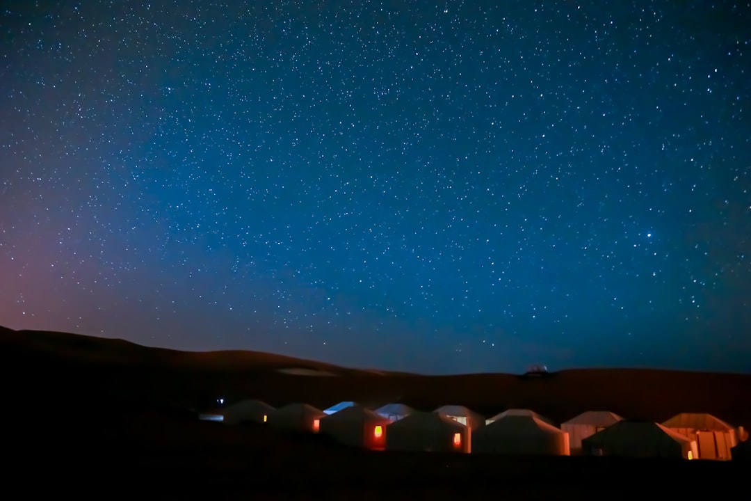 Bedouin tents in Wadi Rum desert under a starlit winter sky