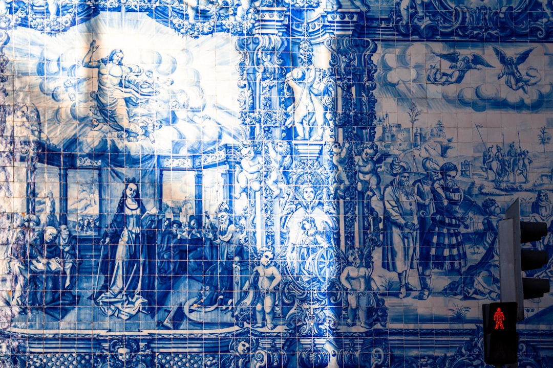 Blue-and-white azulejo panels lining the entrance hall of São Bento railway station.