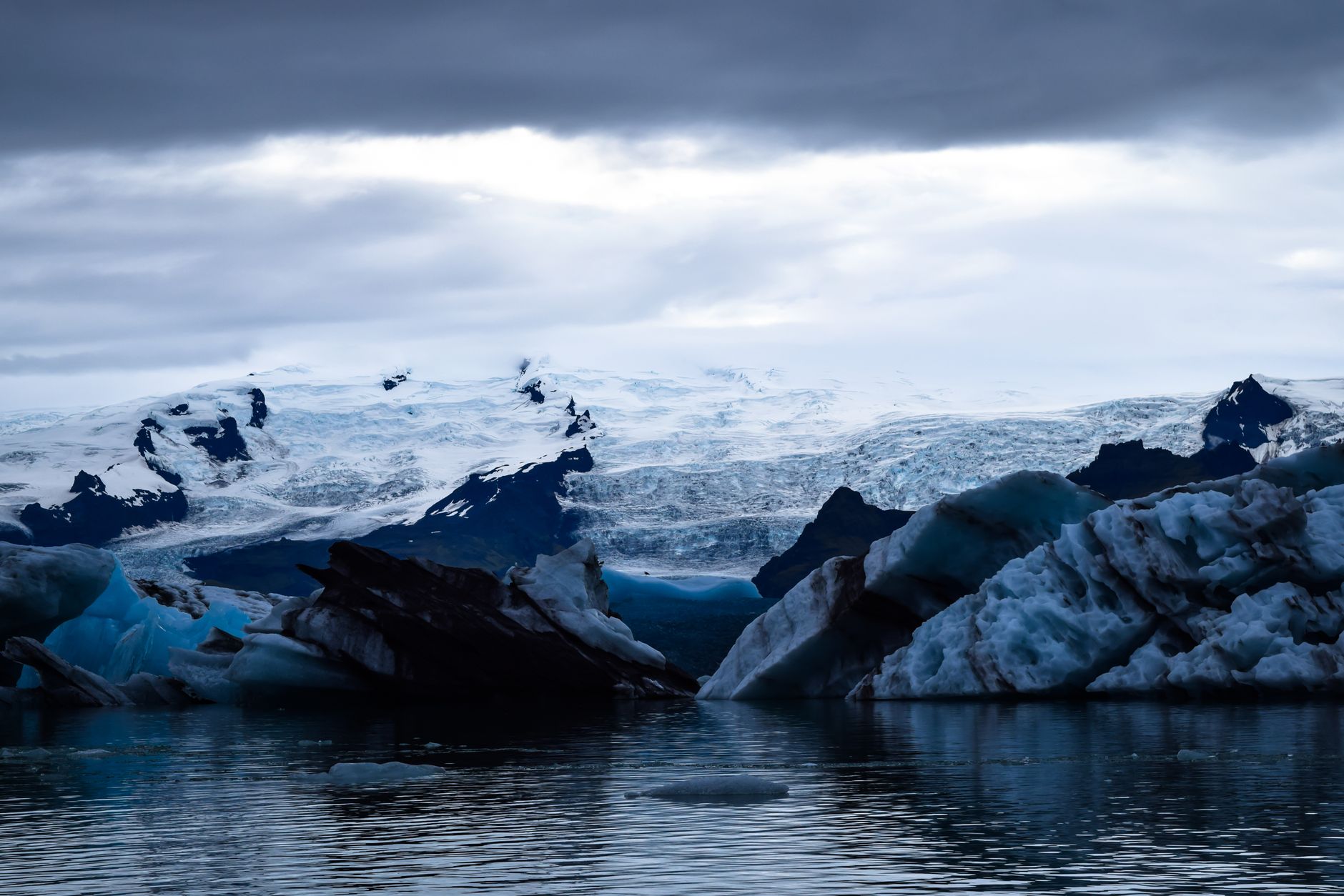 Blue and white icebergs floating in Jökulsárlón glacier lagoon in southeast Iceland