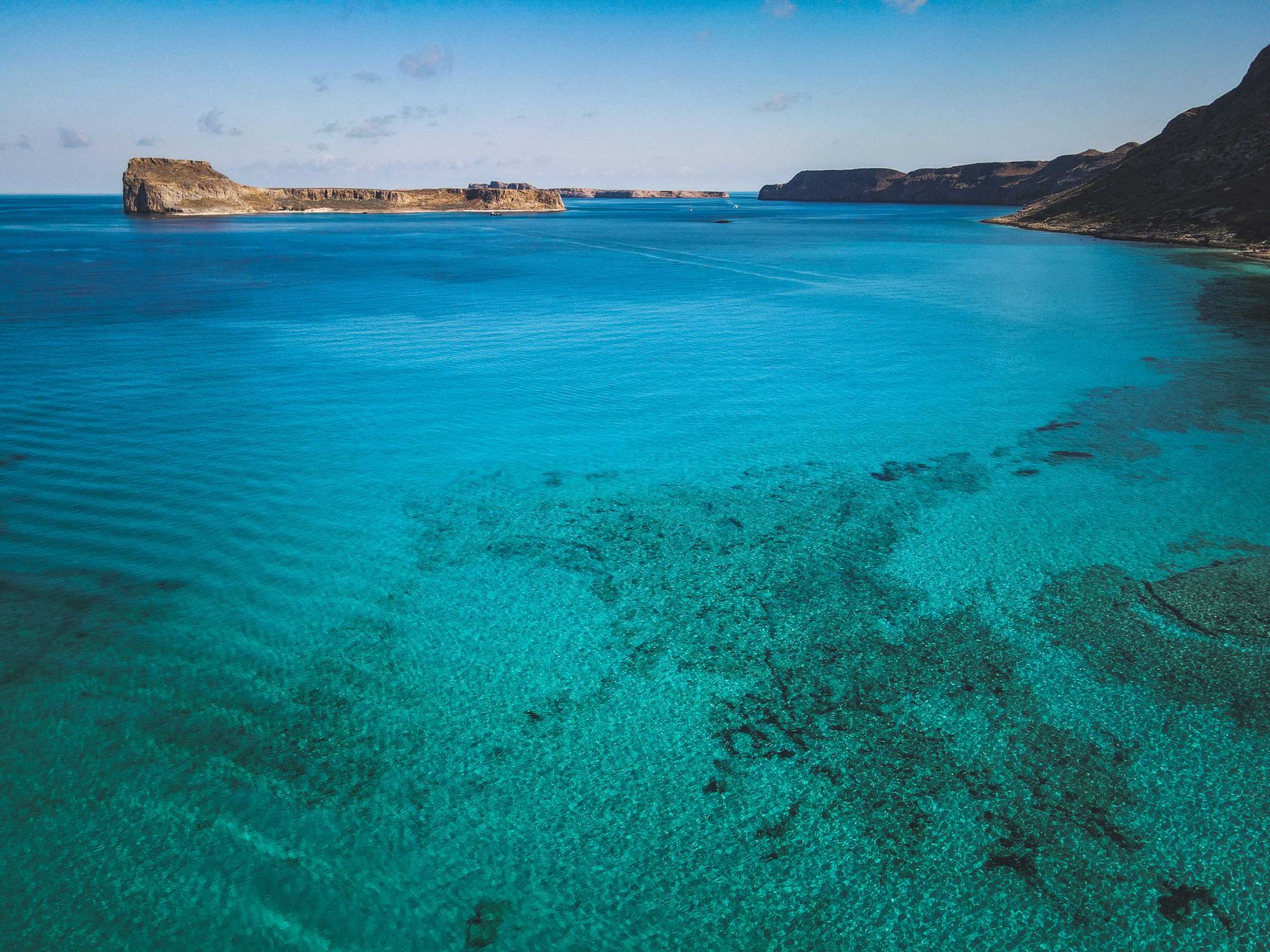 Chalkies Beach on Haslewood Island, a quieter, quartz-sand alternative just across the passage from Hamilton Island.