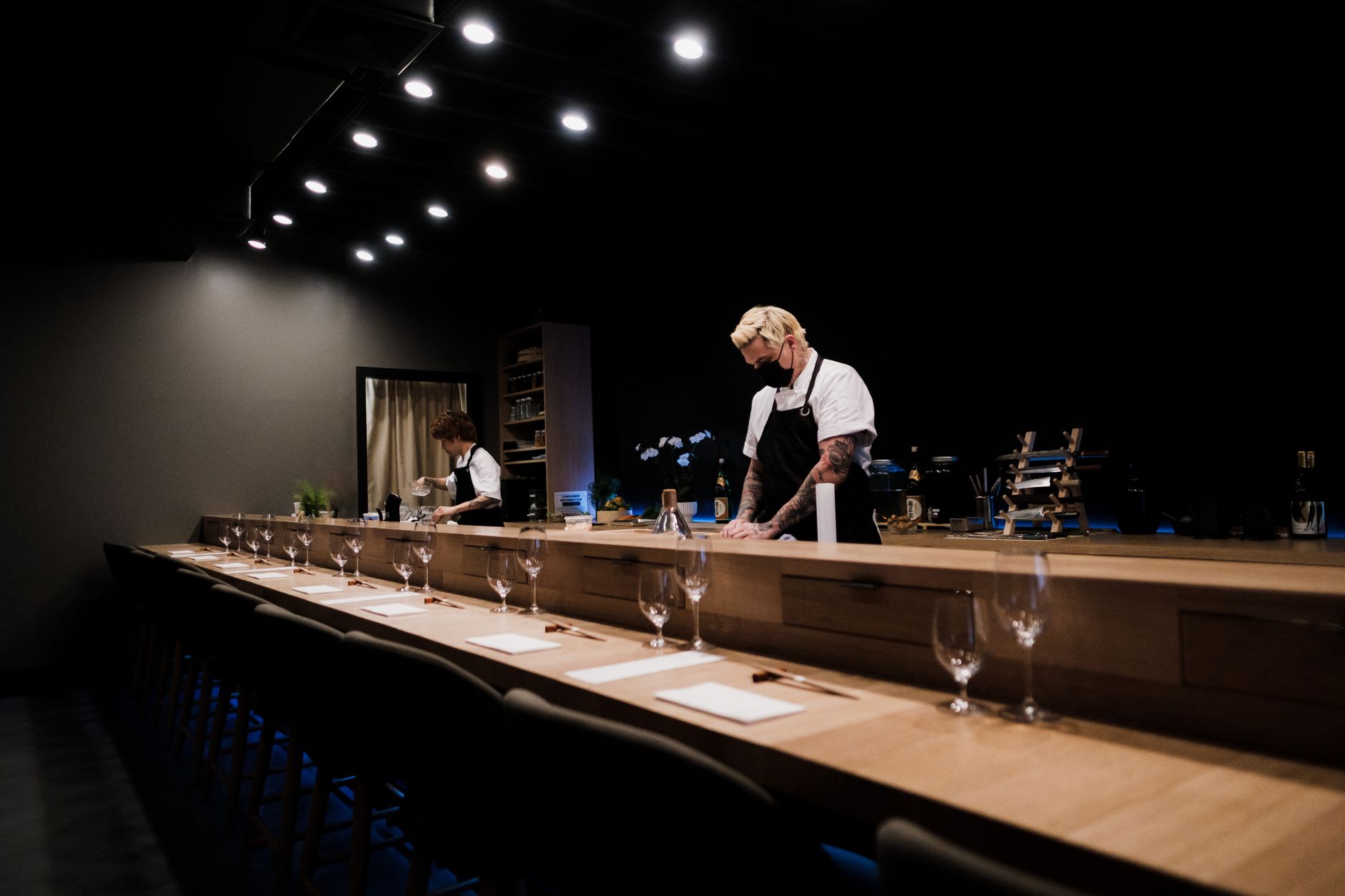 Chef at work behind the counter at Sushi Saito.