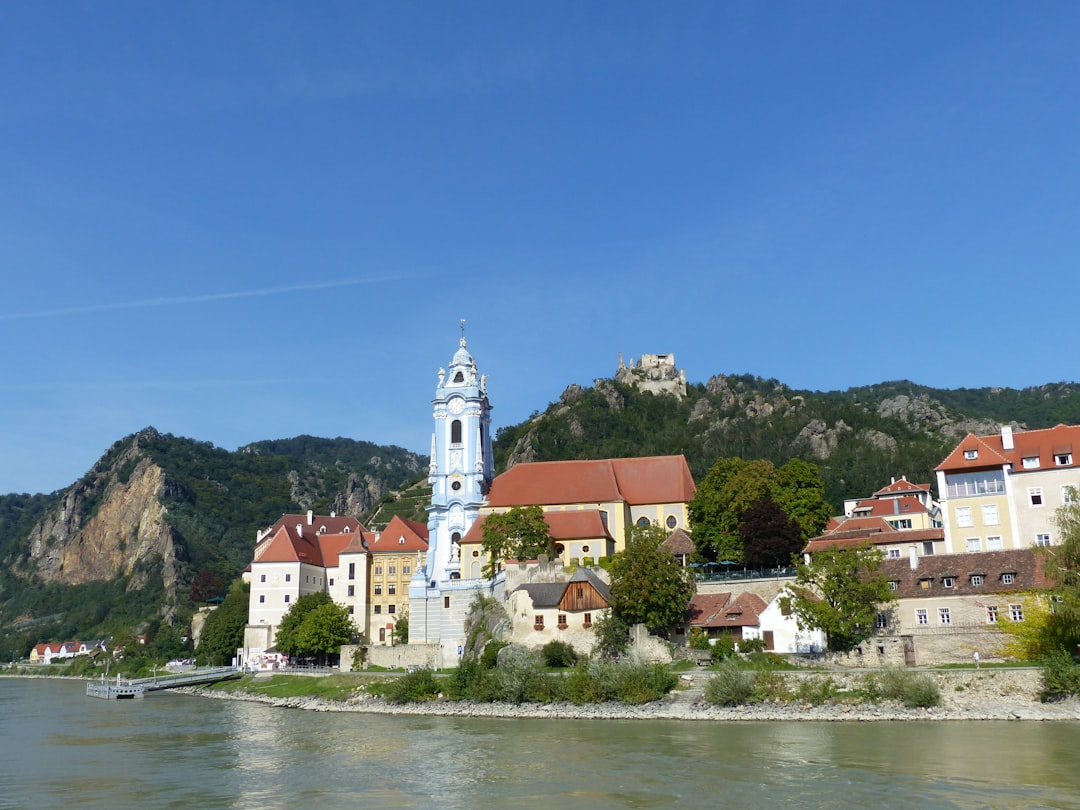 Dürnstein's blue Baroque church tower beneath the ruined 12th-century castle.