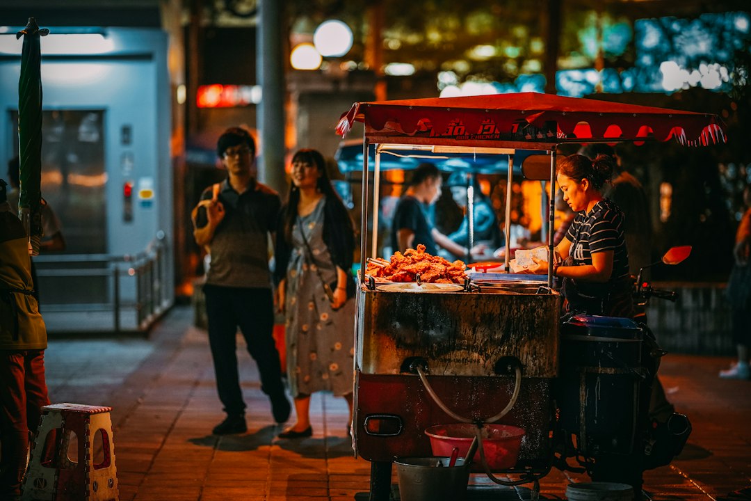 Evening street food vendors come alive when spring temperatures drop below 32°C (90°F).