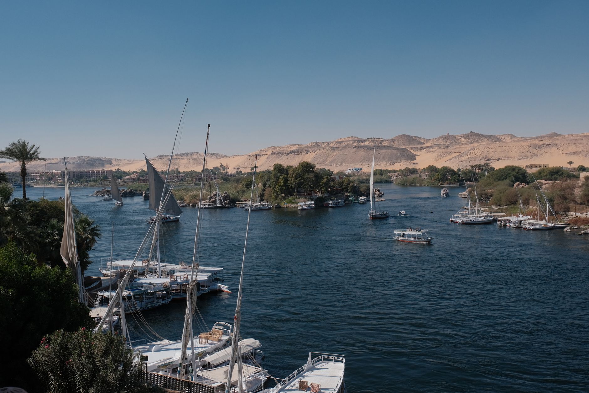 Feluccas crossing toward Elephantine Island as the dahabiya approaches Aswan.