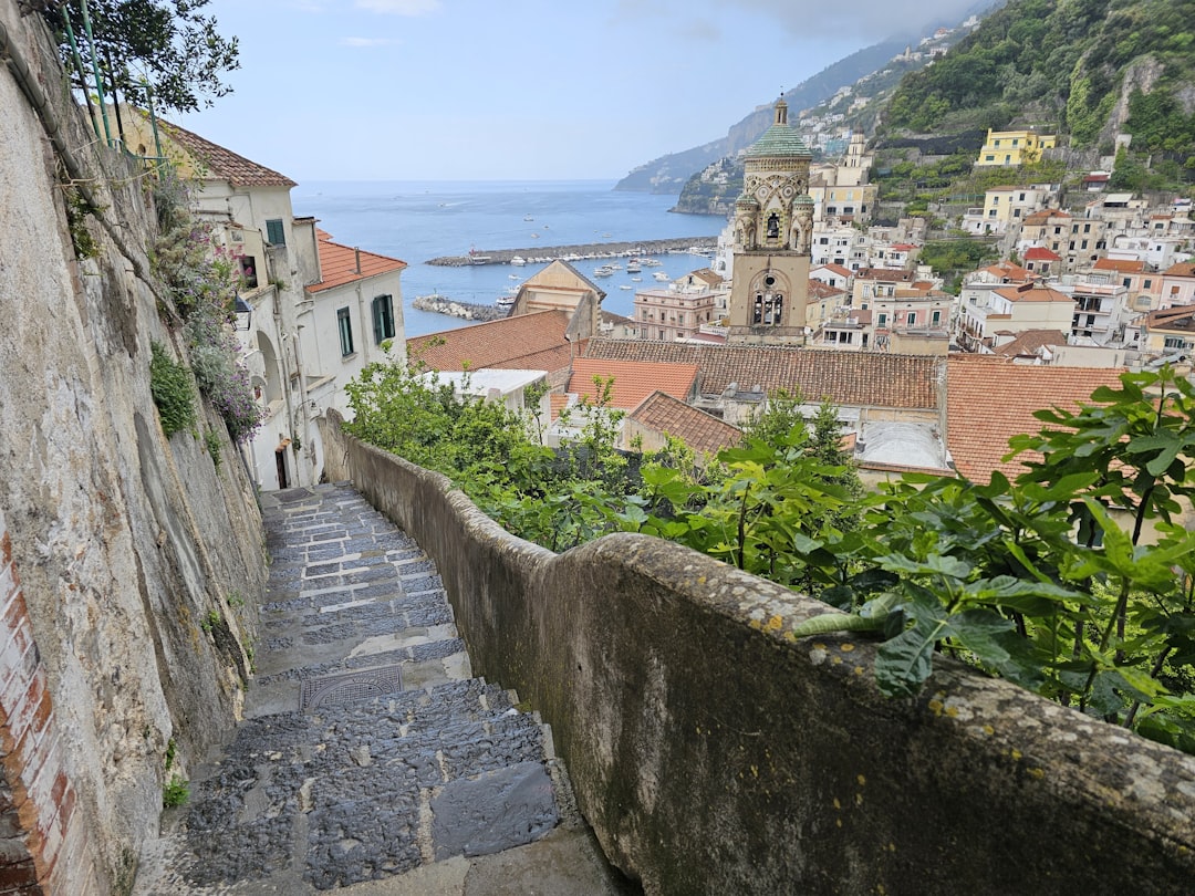 Hikers on the Path of the Gods trail with the Amalfi Coast and sea visible below