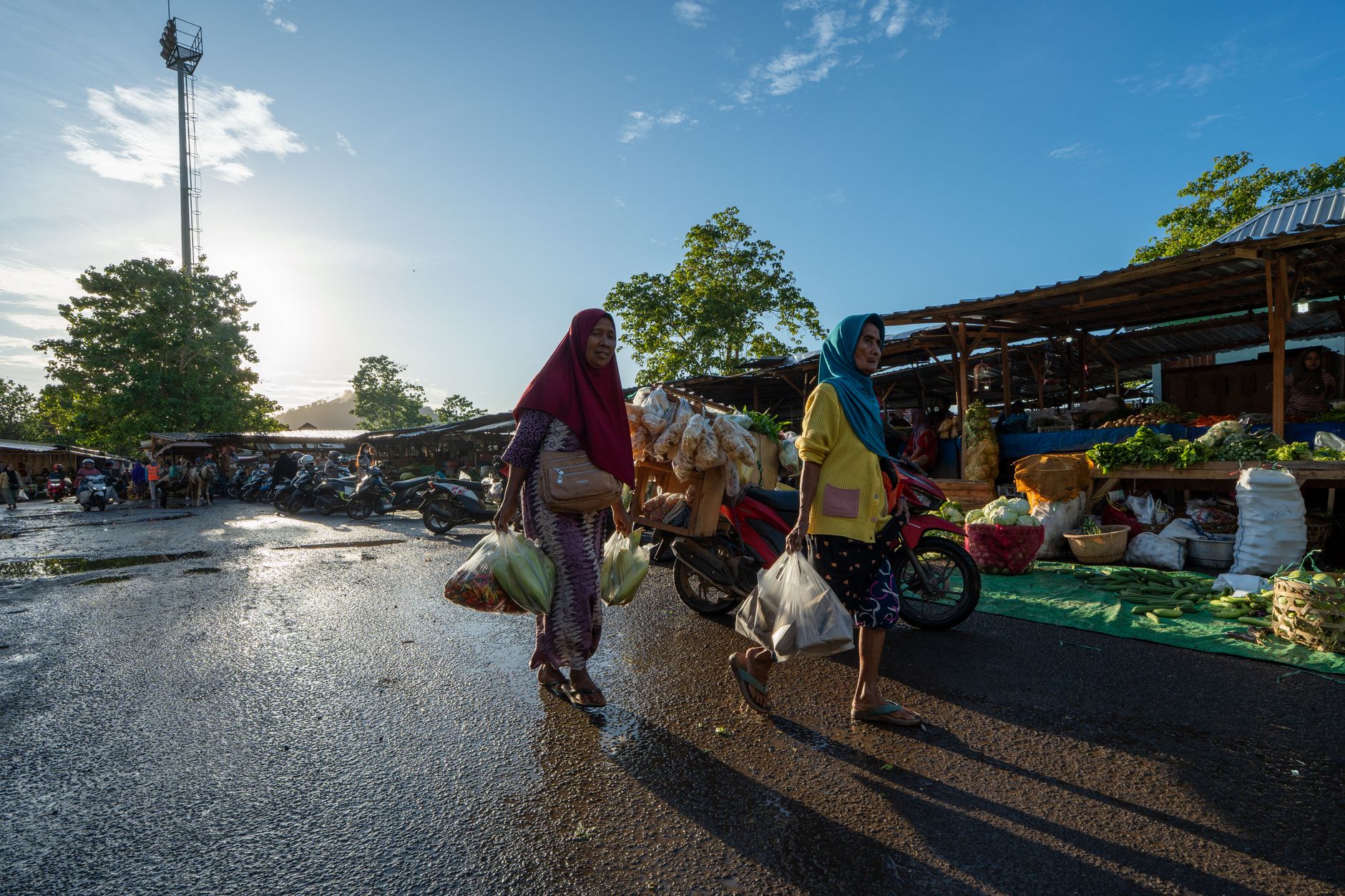 Honiara's main road, Mendana Avenue, lined with market stalls near the waterfront.