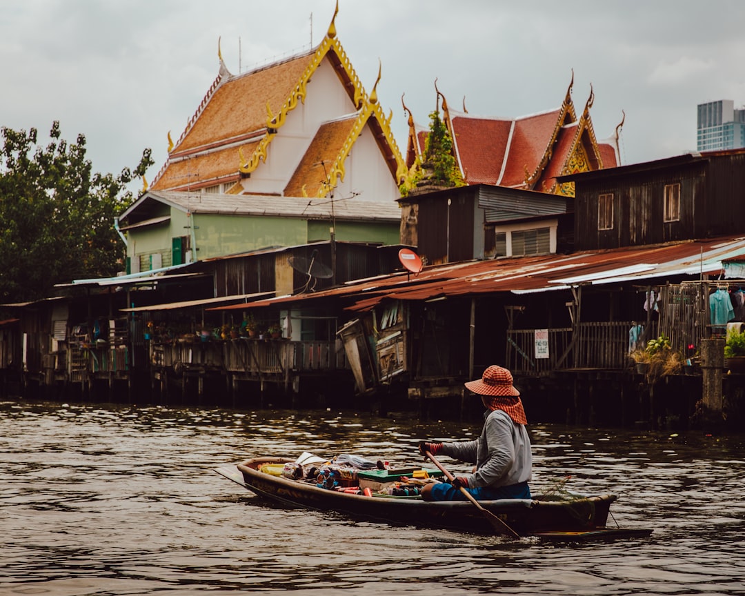 Longtail boats ferry commuters and visitors along the Chao Phraya and into Thonburi's canal network.