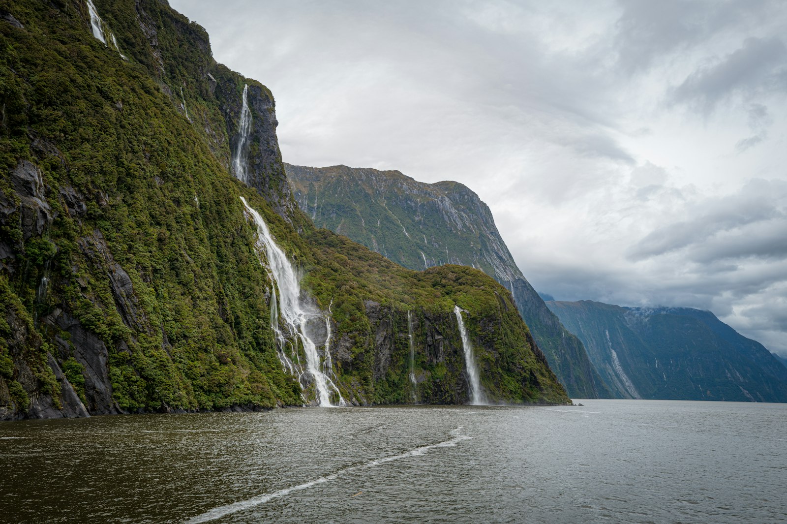 Milford Sound's glacier-carved peaks, the destination at track's end, visible year-round but most dramatic in clear summer conditions