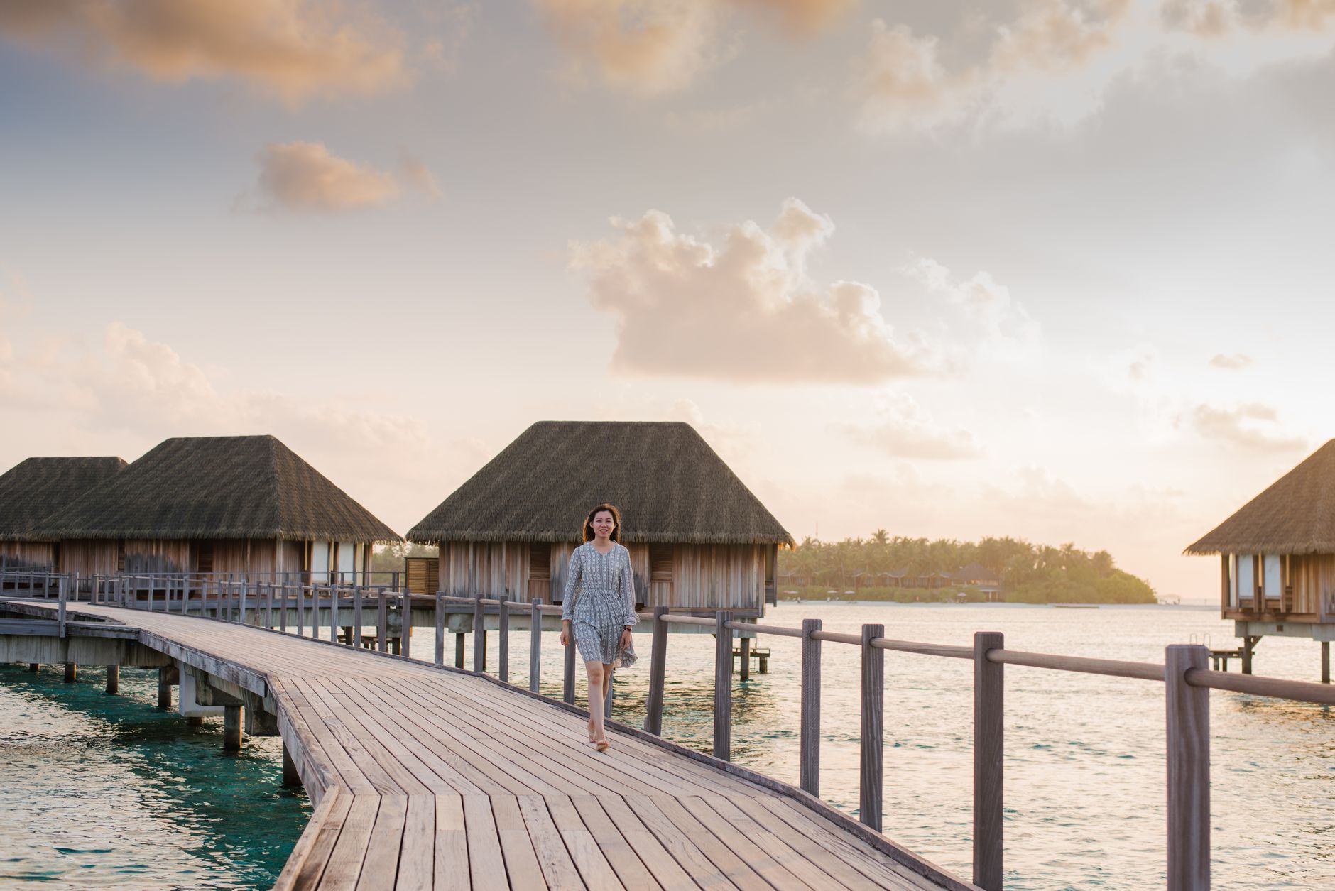 Overwater restaurant jetty at sunset in the Maldives