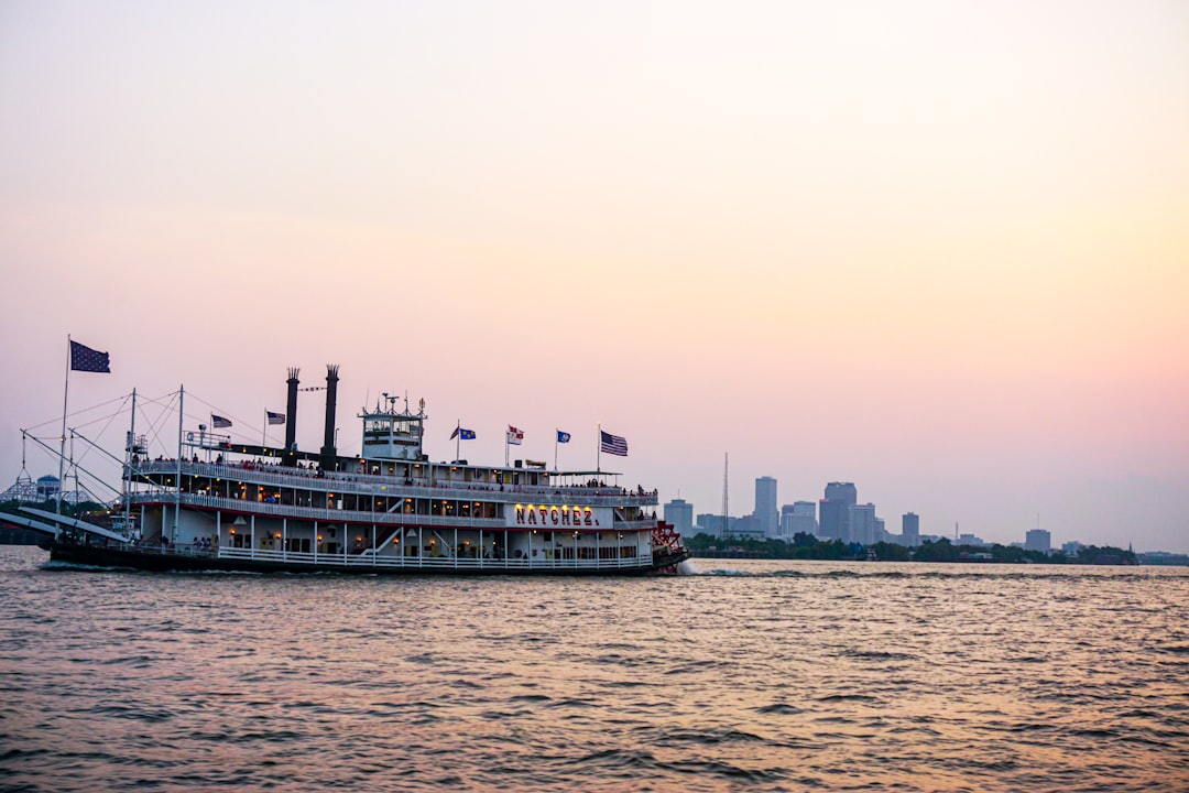 Paddlewheel steamboat cruising the Lower Mississippi River at dusk