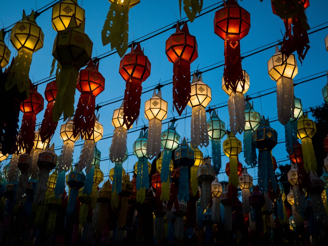 Paper lanterns and food stalls line Ratchadamnoen Road every Sunday evening as the Old City's biggest weekly market unfolds.