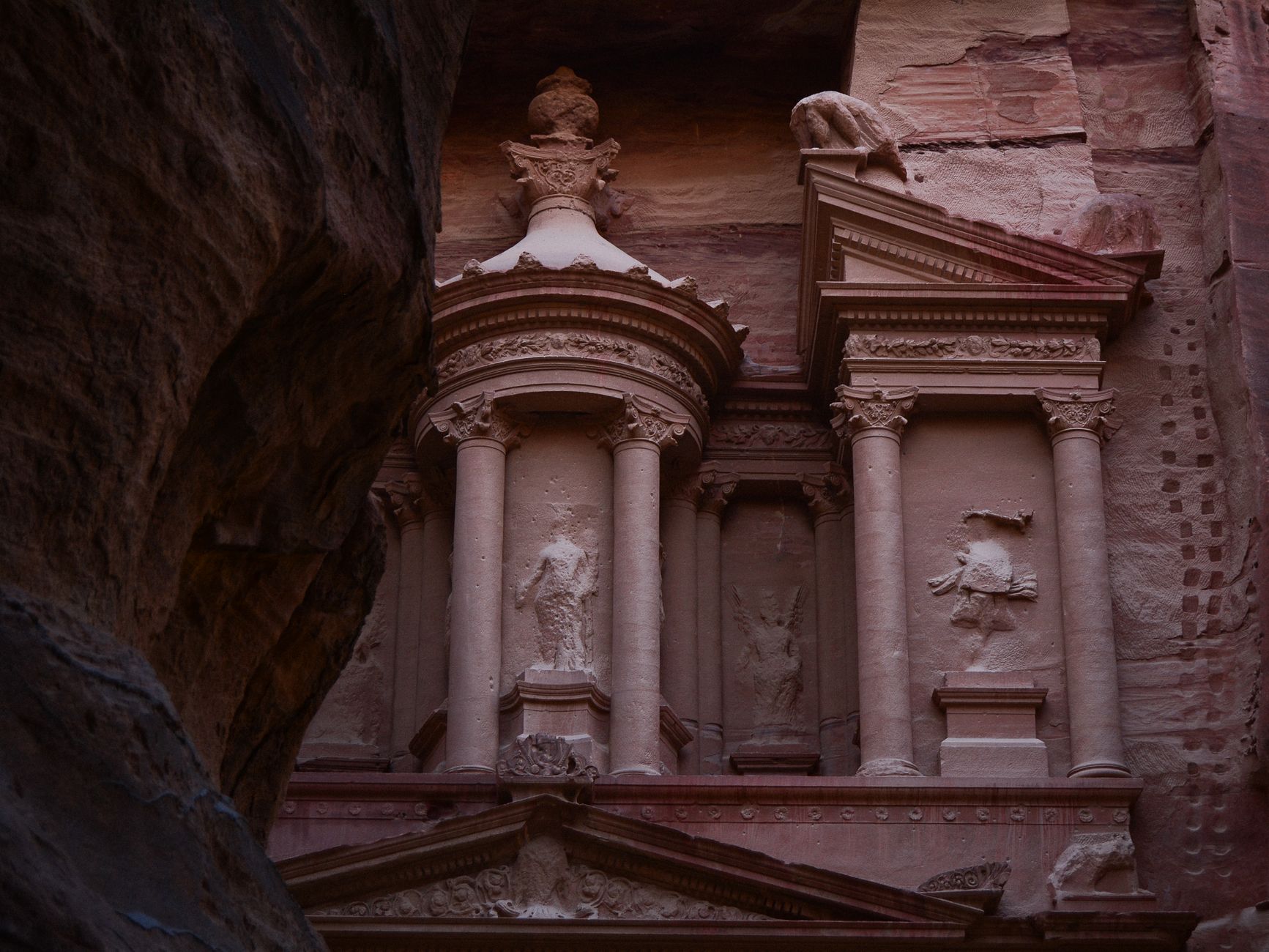 Petra's rose-colored stone reveals true color in winter light without summer heat distortion.