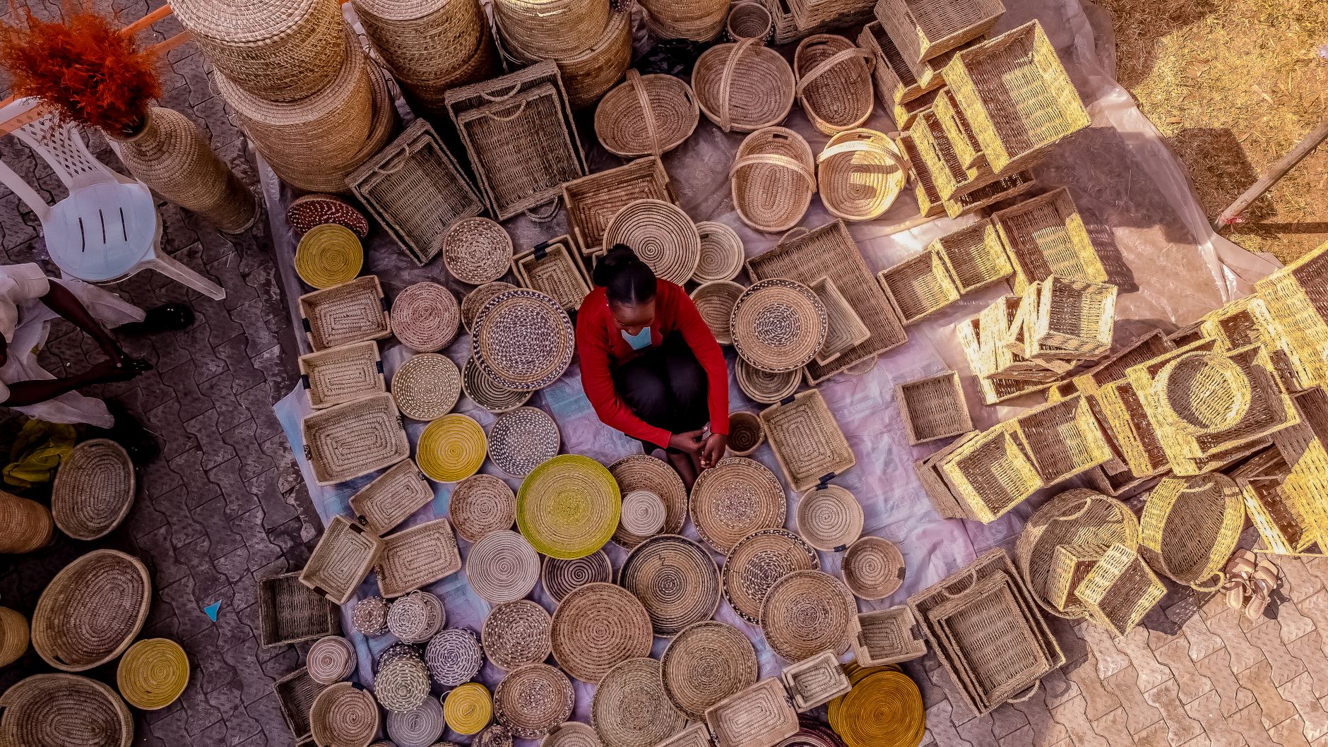 Saturday market below Lalibela town, where sellers lay out teff, berbere, and woven mesob baskets.