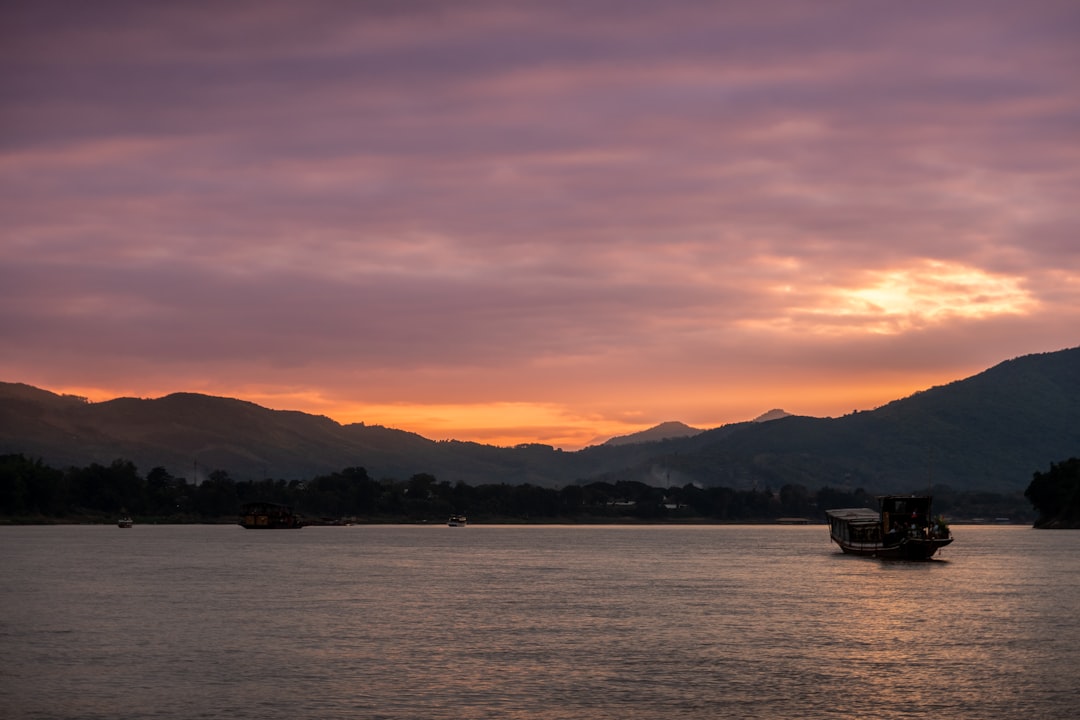 Small river cruise ship on the Mekong River near a Vietnamese floating market
