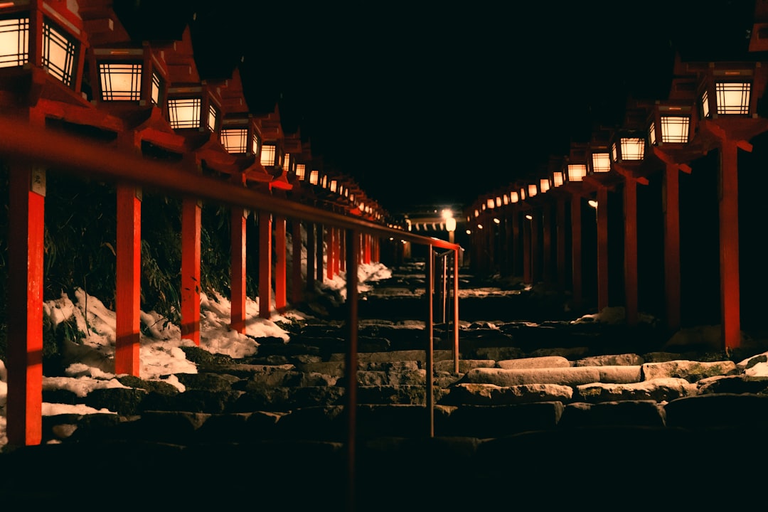 Snow lanterns lining the stone steps at Kifune Shrine during the Kibune Yukiakari evenings in January.