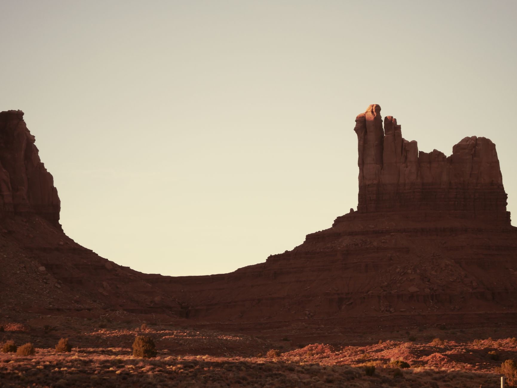 Spider Rock sandstone spire glowing orange at sunset in Canyon de Chelly