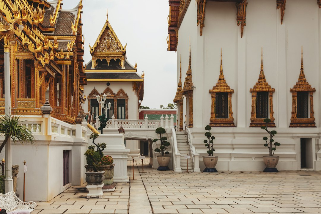 Spring mornings at temples like Wat Saket are quieter and cooler—the light hits the gilded surfaces without haze.