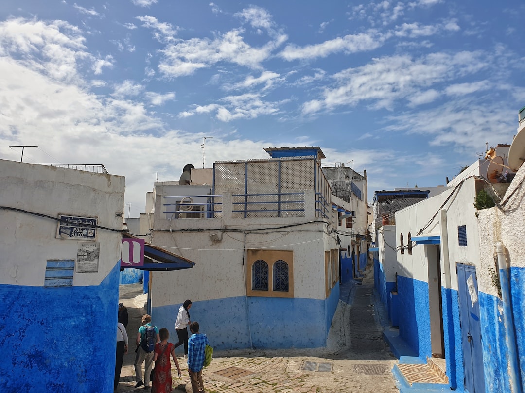 Stone ramparts and blue shutters in Essaouira's walled medina at sunset