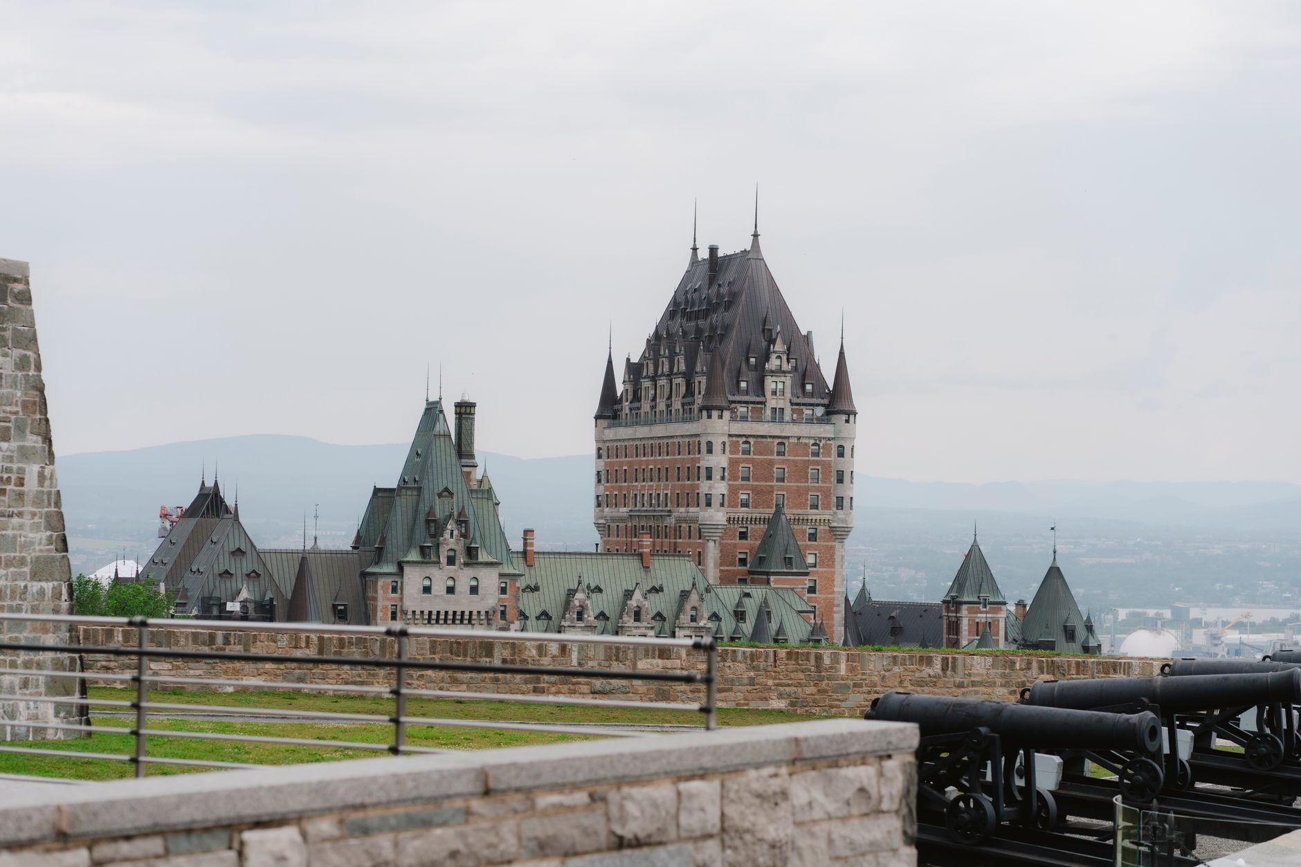 Stone ramparts and the Château Frontenac hotel in Old Quebec City during spring