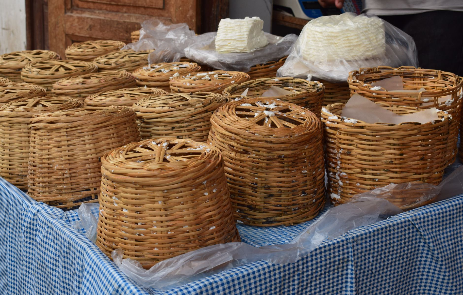 Sweetgrass baskets, a Gullah craft tradition, for sale inside the covered sheds of the Charleston City Market.