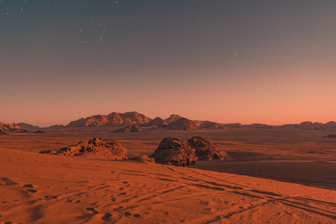 The dunes near Umm Fruth Bridge in Wadi Rum turn deep red as the winter sun drops.