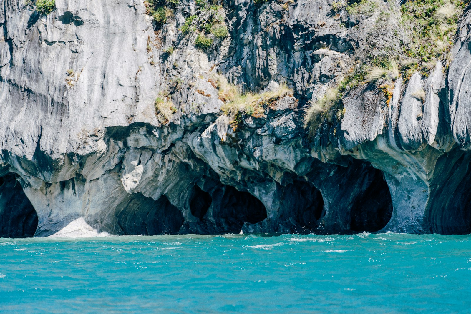 The Emerald Grotto near Conca dei Marini glows from an underwater opening that filters sunlight green.