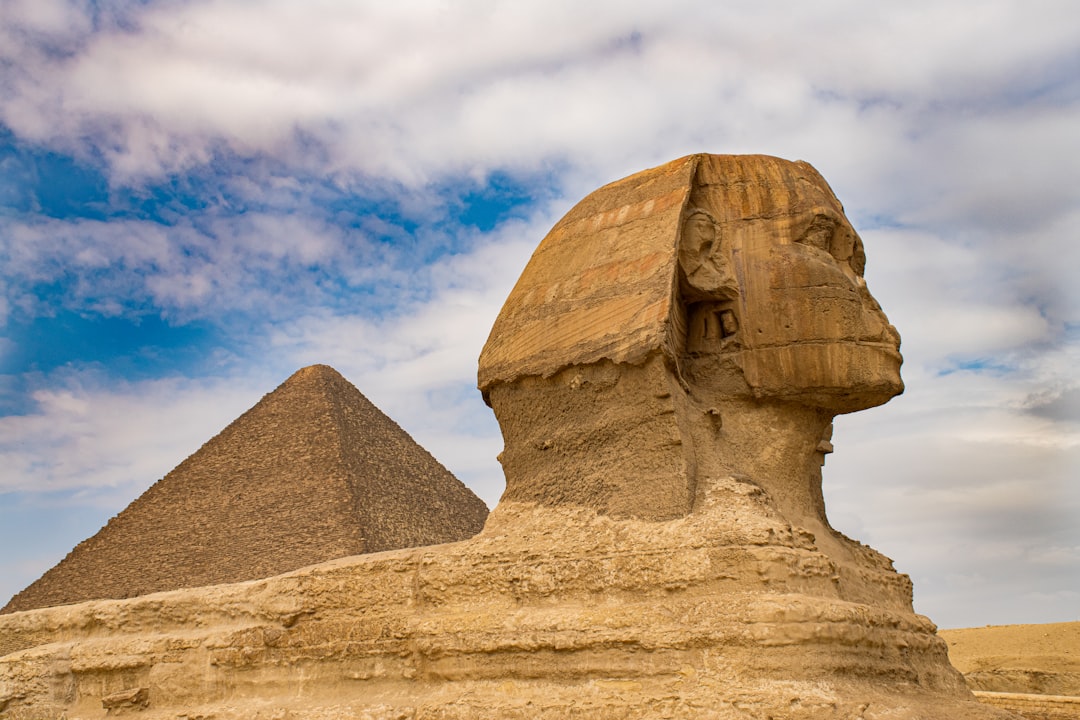 The Great Sphinx, carved from a single limestone outcrop, faces due east toward the sunrise.