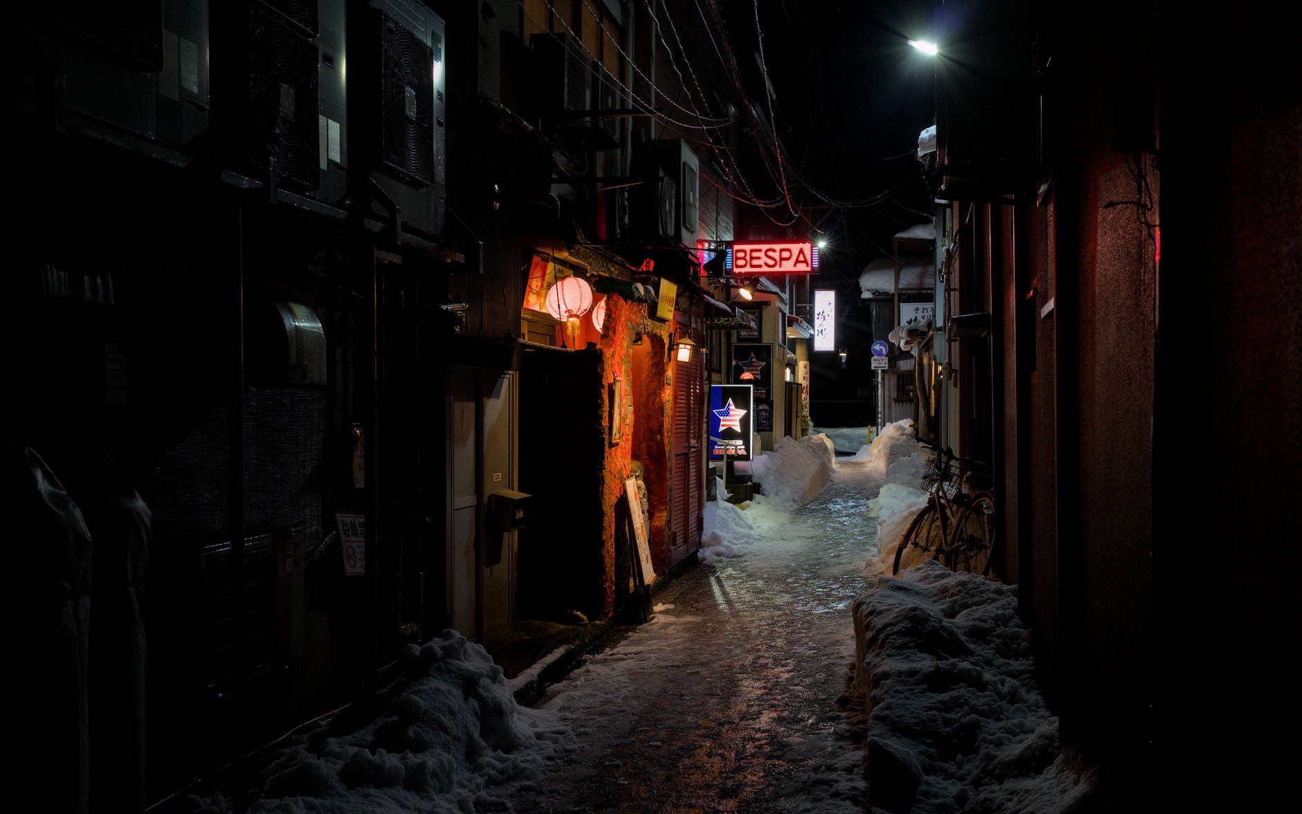 The lane outside my machiya in Nishijin, quiet enough most evenings to hear the sento's furnace two doors down.