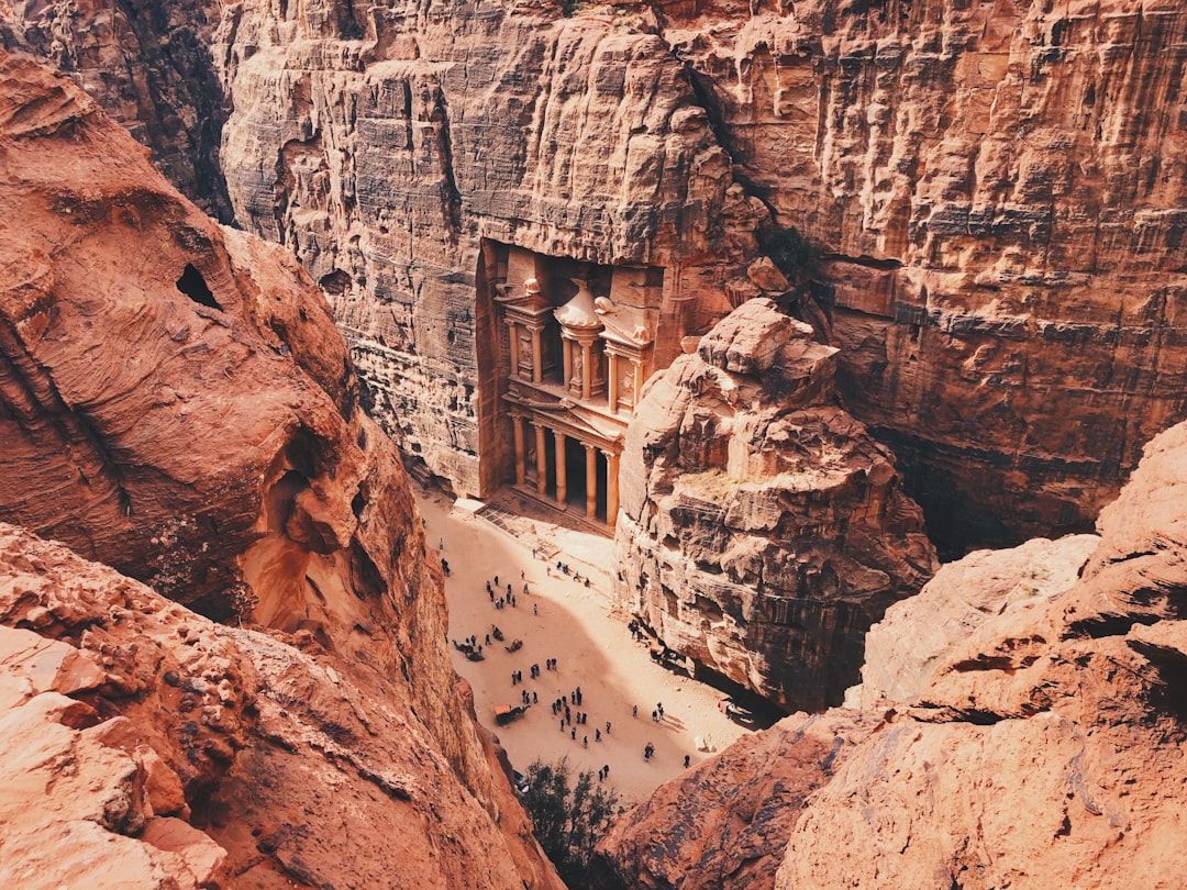 The rose-colored Treasury facade at Petra, Jordan, lit by early winter light