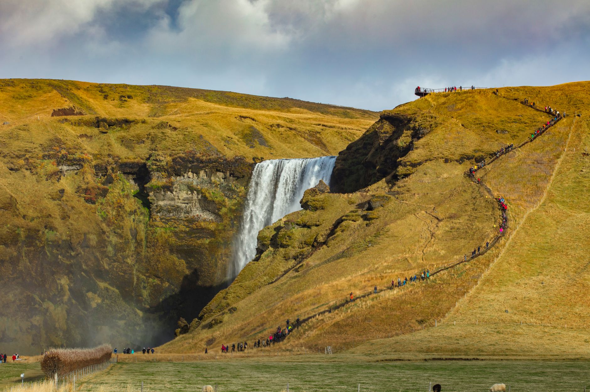 The staircase beside Skógafoss climbs 527 steps to a viewpoint over the falls.