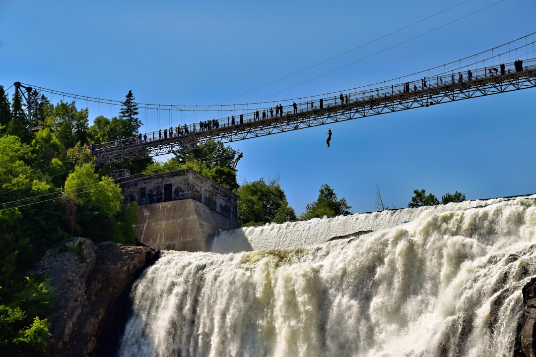 The suspension bridge over Montmorency Falls, running high with spring meltwater.