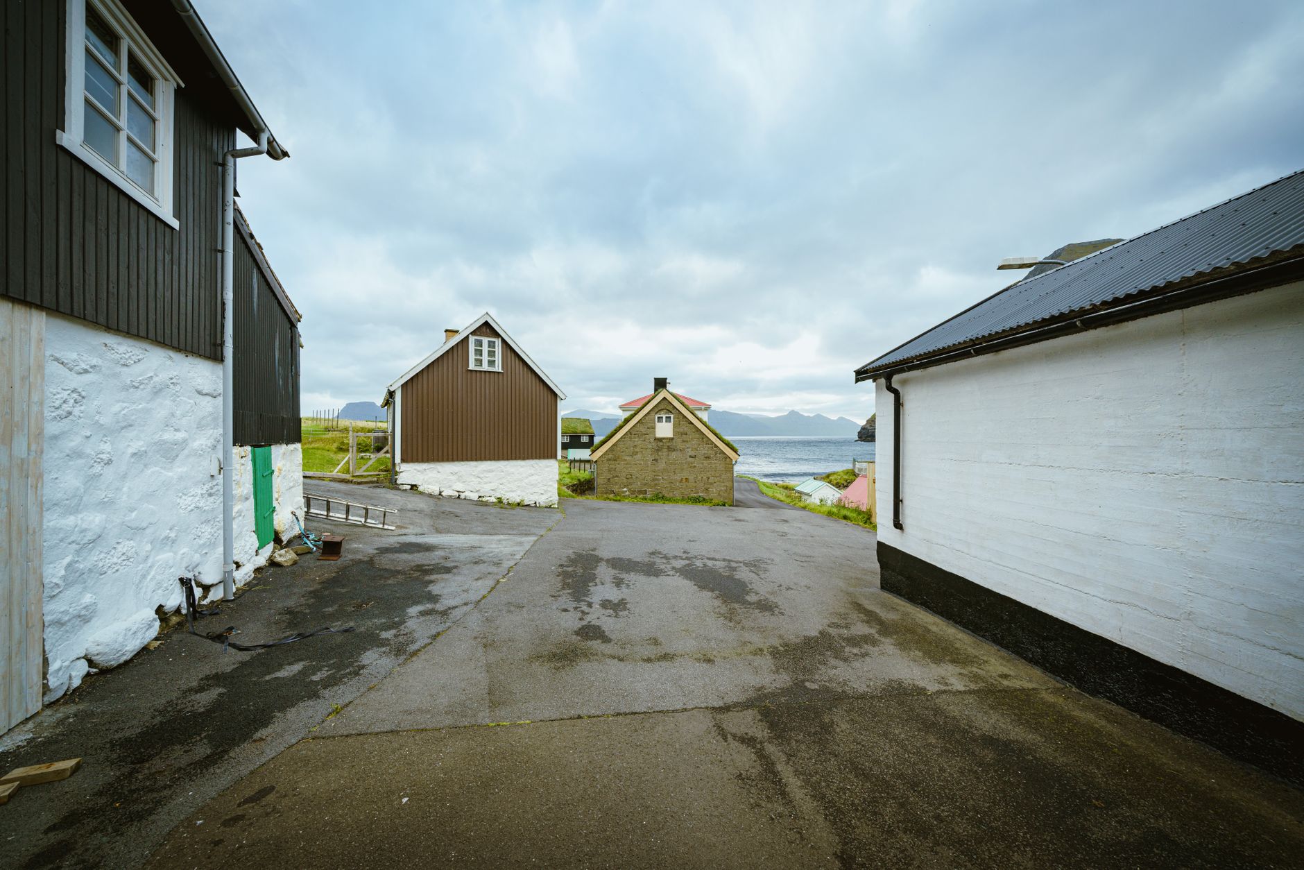 The tar-black, turf-roofed buildings of Tinganes in Tórshavn.