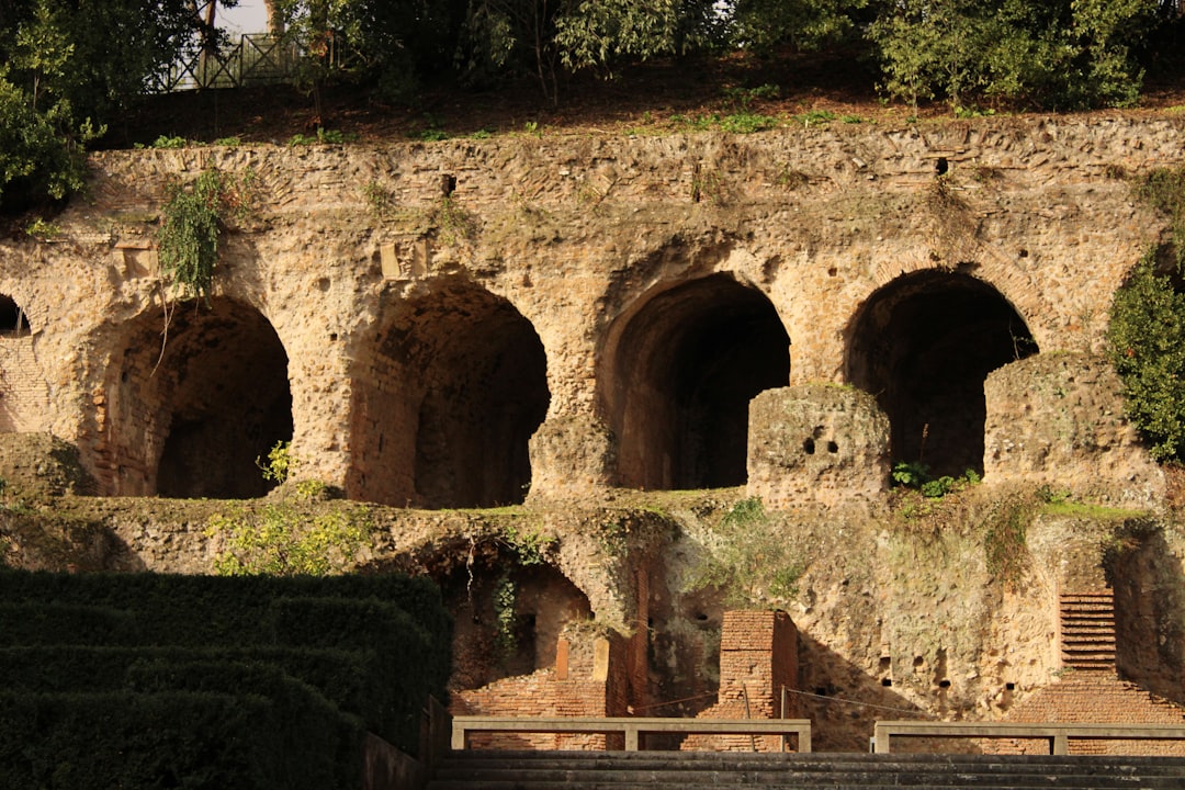 The Teatro Romano's stone seating, first built under Augustus and later enlarged, is still climbable today.