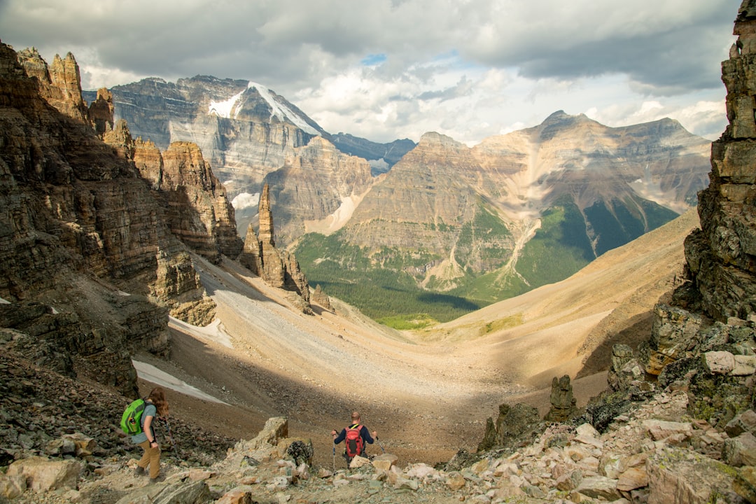 The trail to the Plain of Six Glaciers Teahouse climbs above the lake toward Victoria Glacier.