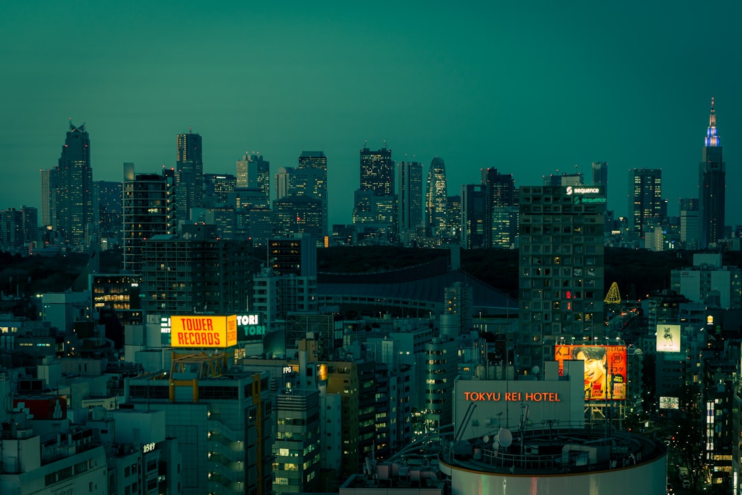 Tokyo skyline at sunset with autumn colors visible in Shinjuku district