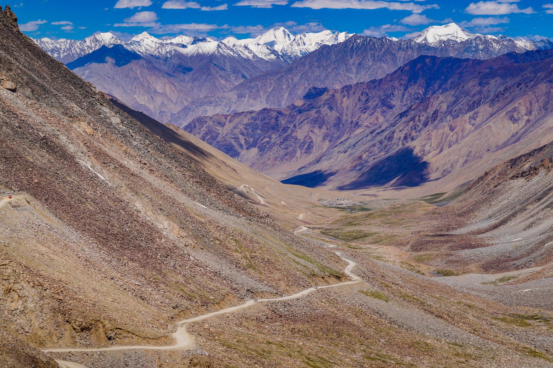 Trekkers on the Markha Valley trail with Kang Yatse peak visible in the distance