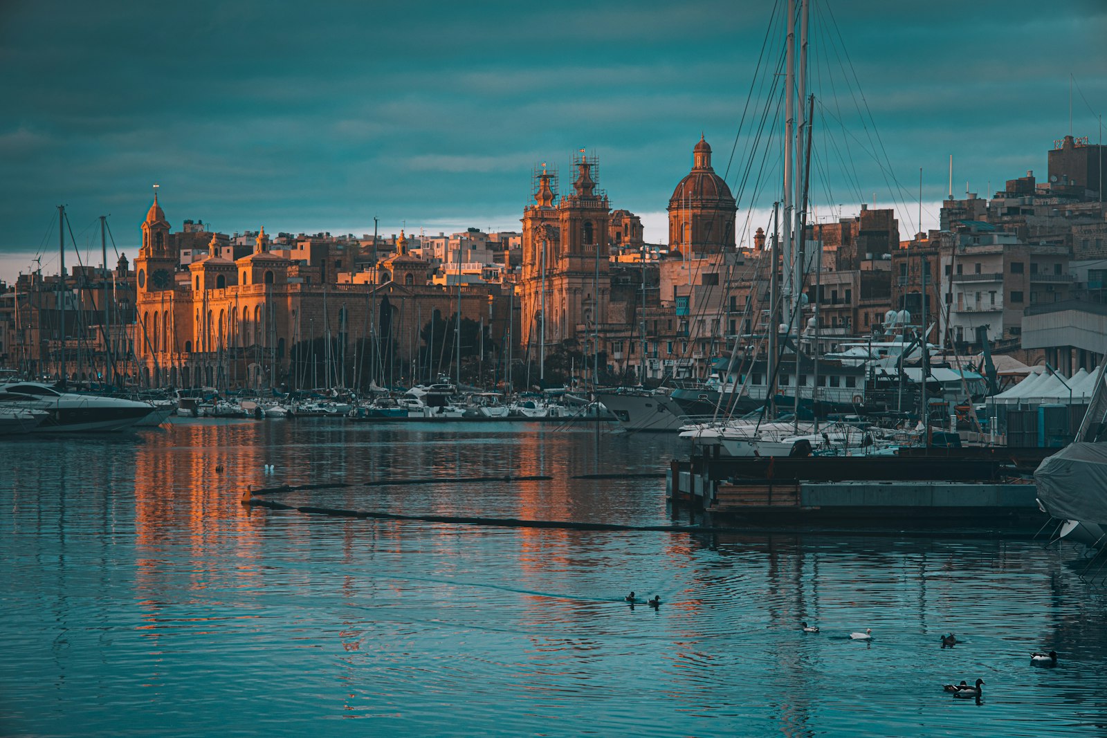Valletta's limestone buildings and fortifications rising above the Mediterranean harbor