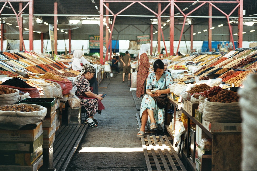 Vendors and fresh produce at a covered market in Hoi An, Vietnam