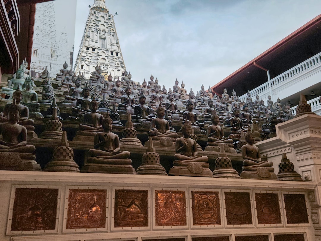 Wat Arun's porcelain-inlaid spires catch the last light from the river most evenings.