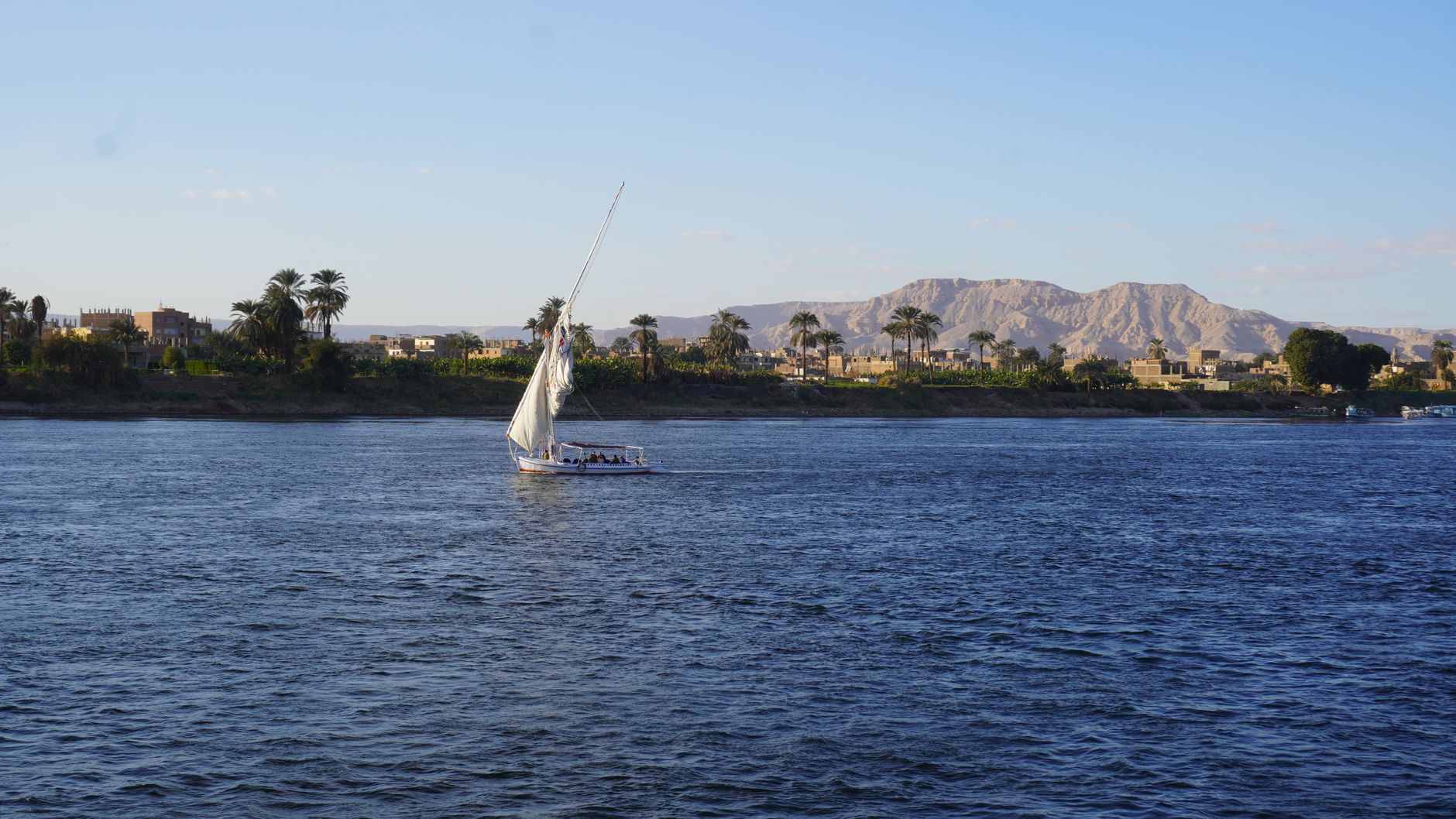 White-sailed dahabiya boat on the Nile River near Kom Ombo, Egypt